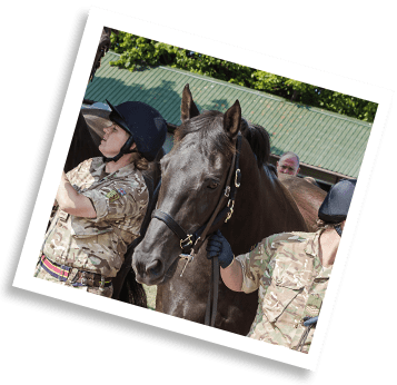 Black horse walking with soldier